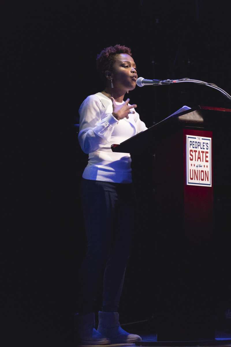 Karine Jean-Pierre speaks at a podium.