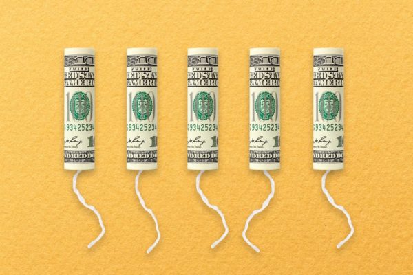A row of tampons with $100 bills on them.