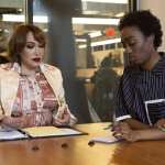 A transfeminine executive meeting with a non-binary employee