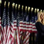 Ivanka Trump giving a speech in front of a row of American flags.