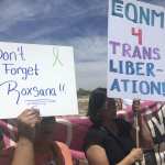 Protesters hold up signs as they gather outside a U.S. Immigration and Customs Enforcement office in Albuquerque, New Mexico, on Wednesday, June 6, 2018. Immigrant and LGBT rights advocates held the protest in response to the death of Roxsana Hernandez, a Honduran transgender woman who was in ICE custody and showing signs of pneumonia, dehydration and complications associated with HIV when she was admitted to an Albuquerque hospital last month.