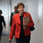 Sen. Jeanne Shaheen of New Hampshire, in a red blazer, arriving for a meeting on Capitol Hill in 2020.