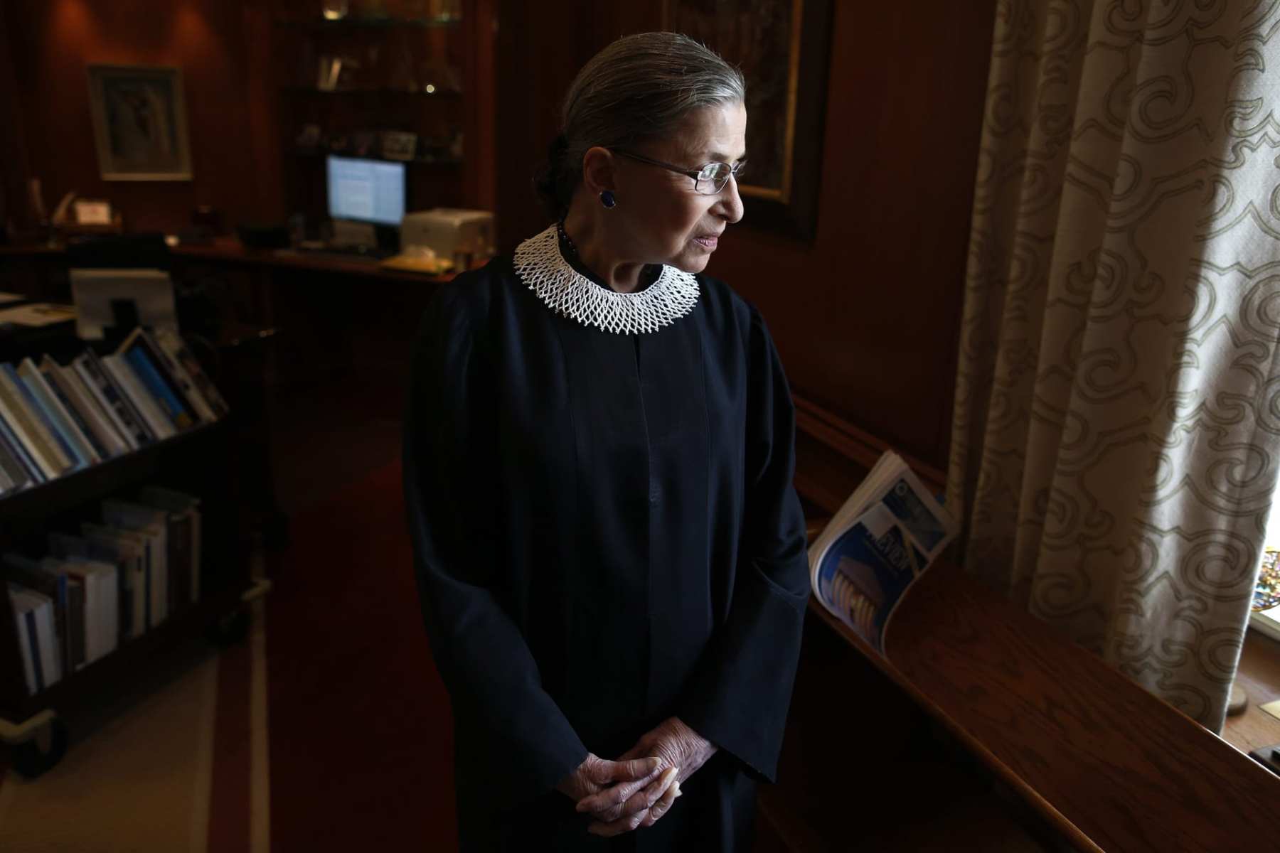 Associate Justice Ruth Bader Ginsburg poses for a photo in her chambers at the Supreme Court in Washington, Wednesday, July 24, 2013, before an interview with the Associated Press. Ginsburg said during the interview that it was easy to foresee that Southern states would push ahead with tougher voter identification laws and other measures once the Supreme Court freed them from strict federal oversight of their elections.