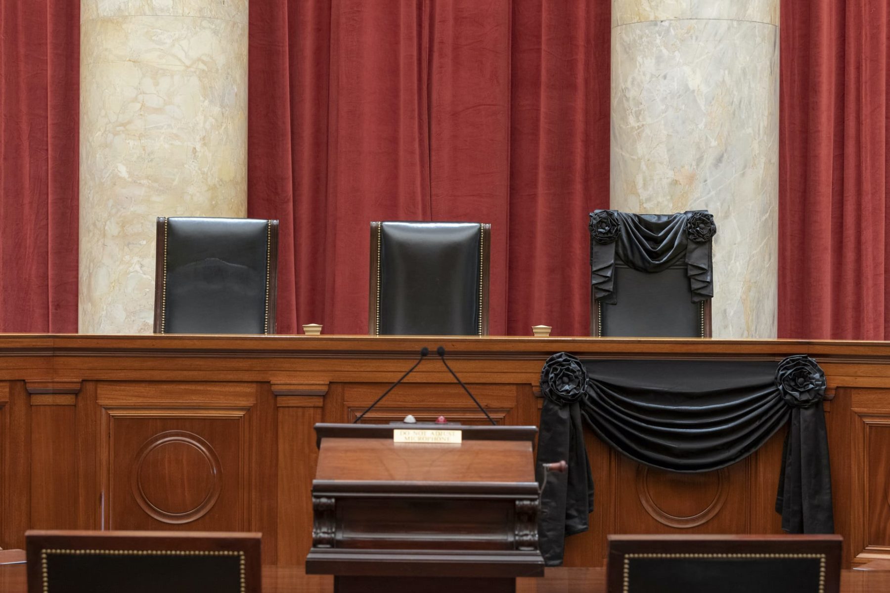 The bench at the U.S. Supreme Court draped in black.
