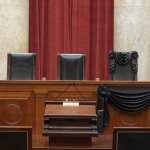 The bench at the U.S. Supreme Court draped in black.