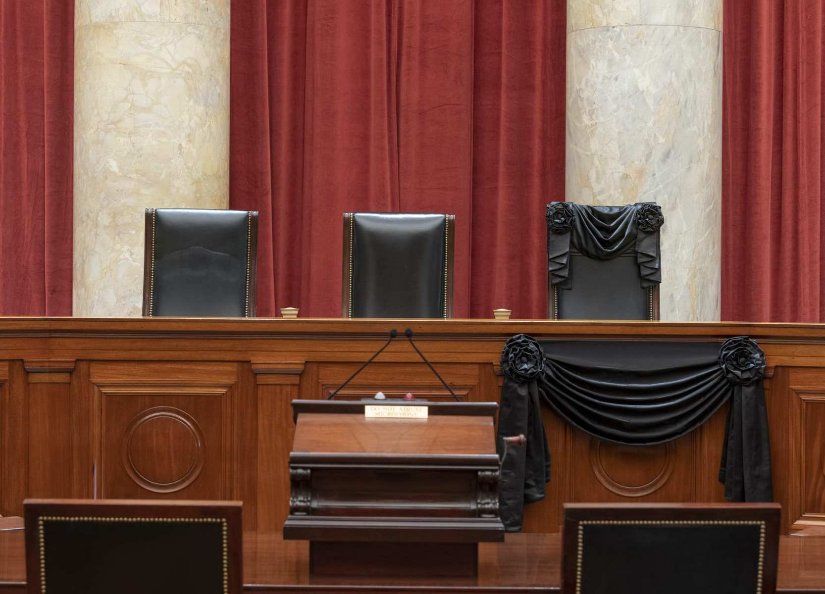 The bench at the U.S. Supreme Court draped in black.