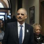 Former Attorney General Eric Holder arrives for a ceremony to unveil the new Gwen Ifill Black Heritage Commemorative Forever Stamp during a Postal Service ceremony at the Metropolitan African Methodist Episcopal Church, Thursday, Jan. 30, 2020, in Washington.