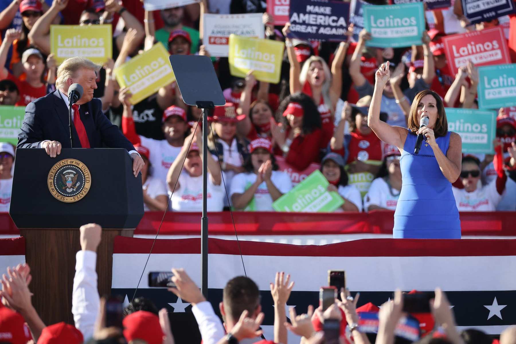 GOODYEAR, ARIZONA - OCTOBER 28: Sen. Martha McSally (R-AZ) (R) praises U.S. President Donald Trump during a campaign rally at Phoenix Goodyear Airport October 28, 2020 in Goodyear, Arizona. With less than a week until Election Day, Trump and his opponent, Democratic presidential nominee Joe Biden, are campaigning across the country. (Photo by Chip Somodevilla/Getty Images)