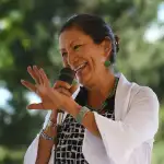 Deb Haaland, one of the first Native Americans in Congress, waves.