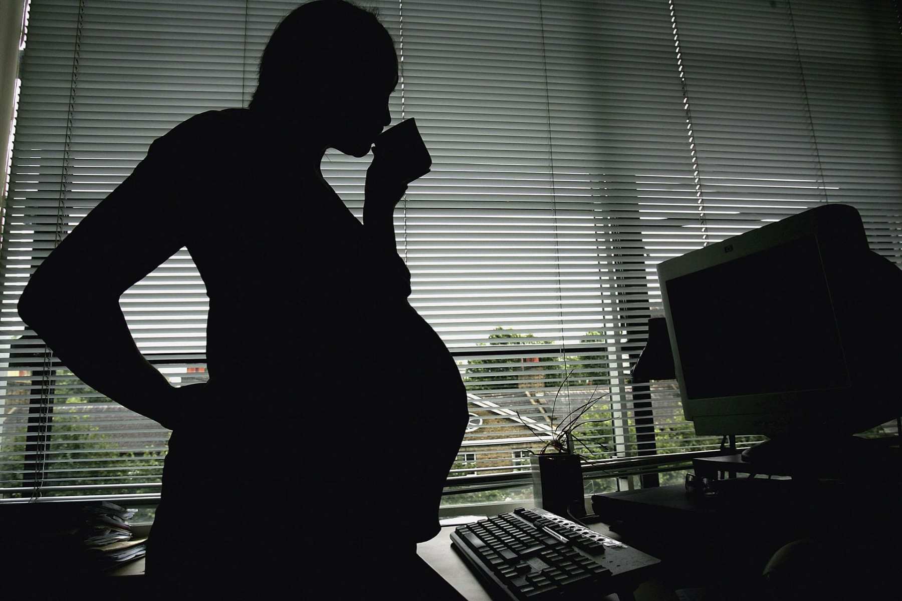 A silhouette of a pregnant woman.