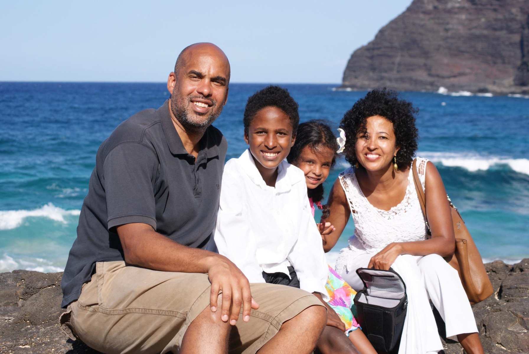 A family sits on a beach