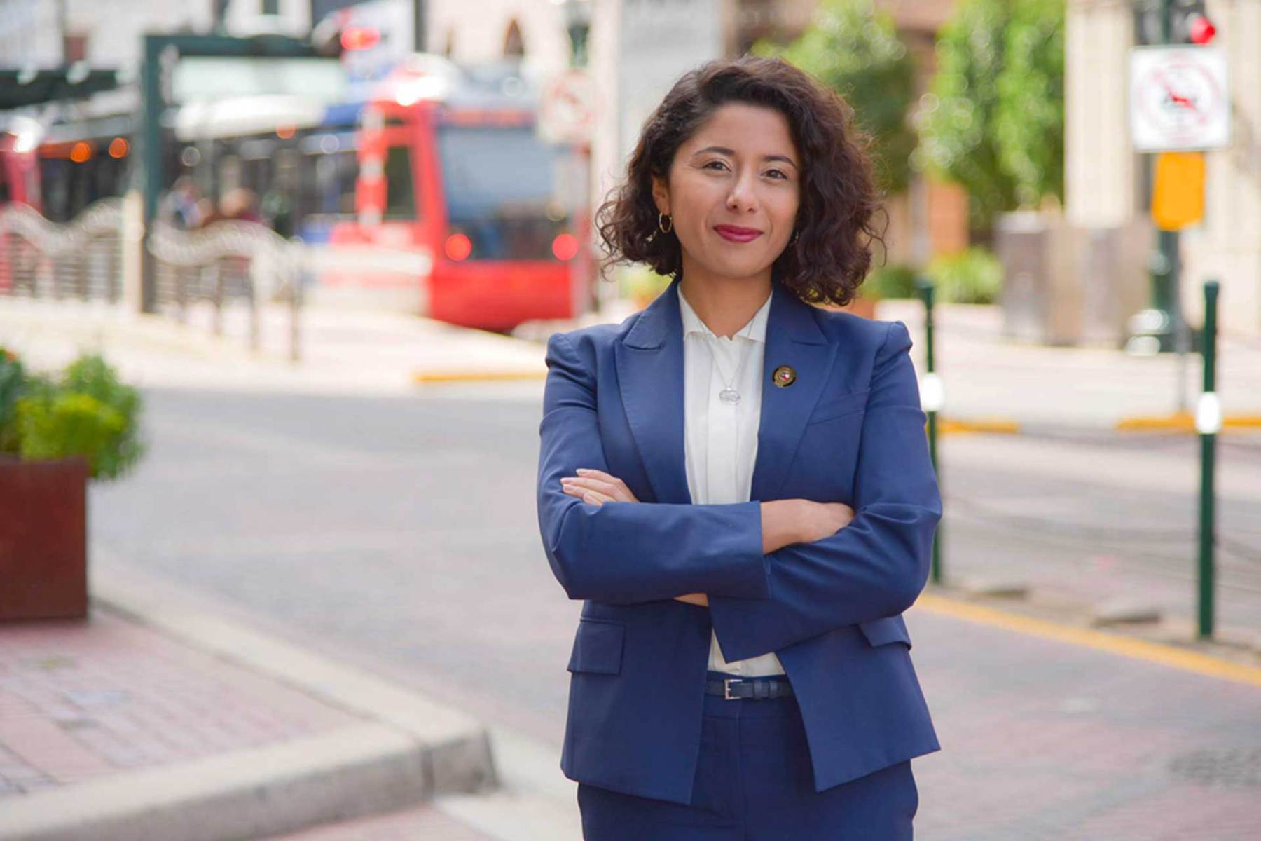 Lina Hidalgo stands on a street in Houston.