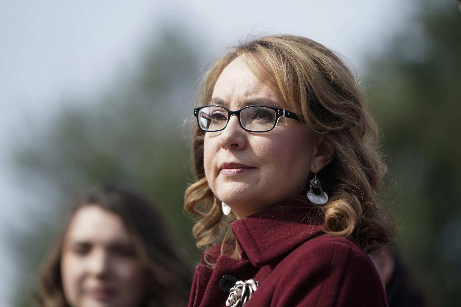 Former Rep. Gabby Giffords listens to lawmakers.