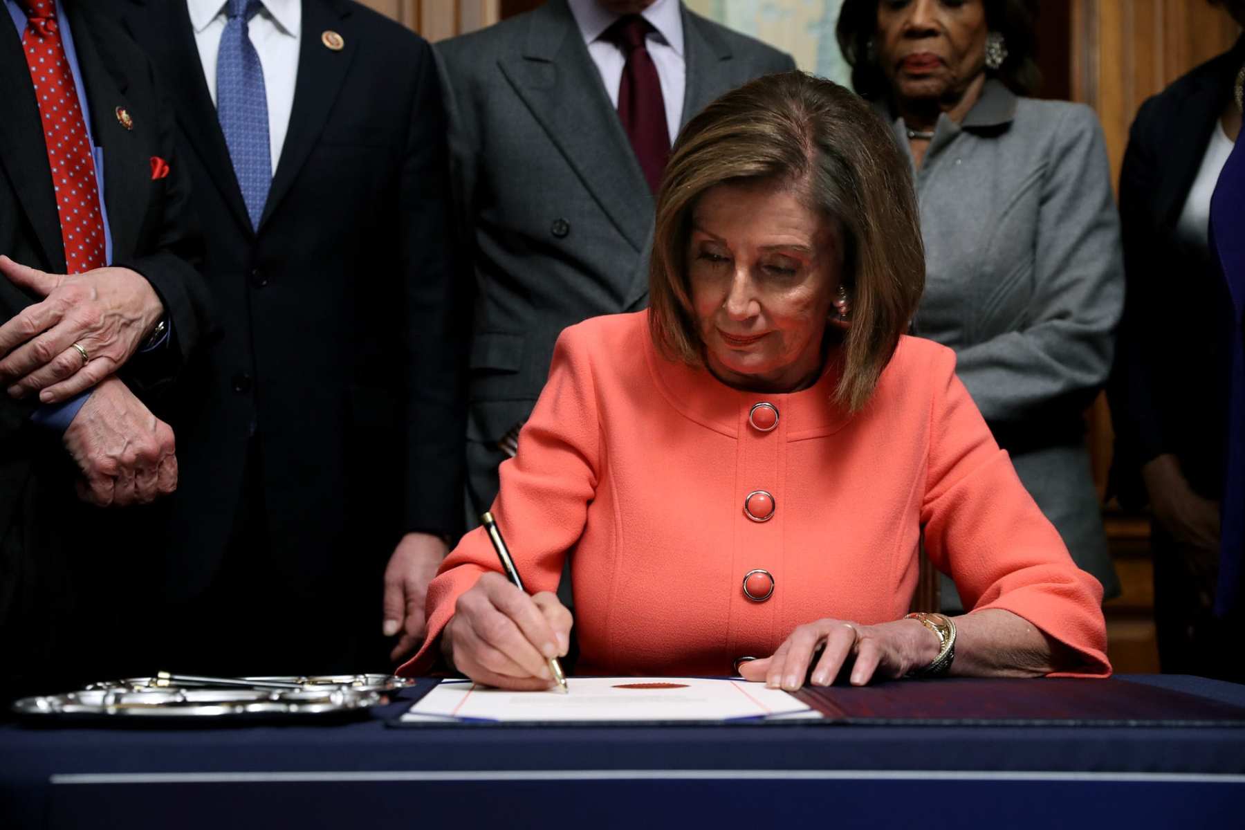 U.S. Speaker of the House Nancy Pelosi (D-CA) signs the articles of impeachment.