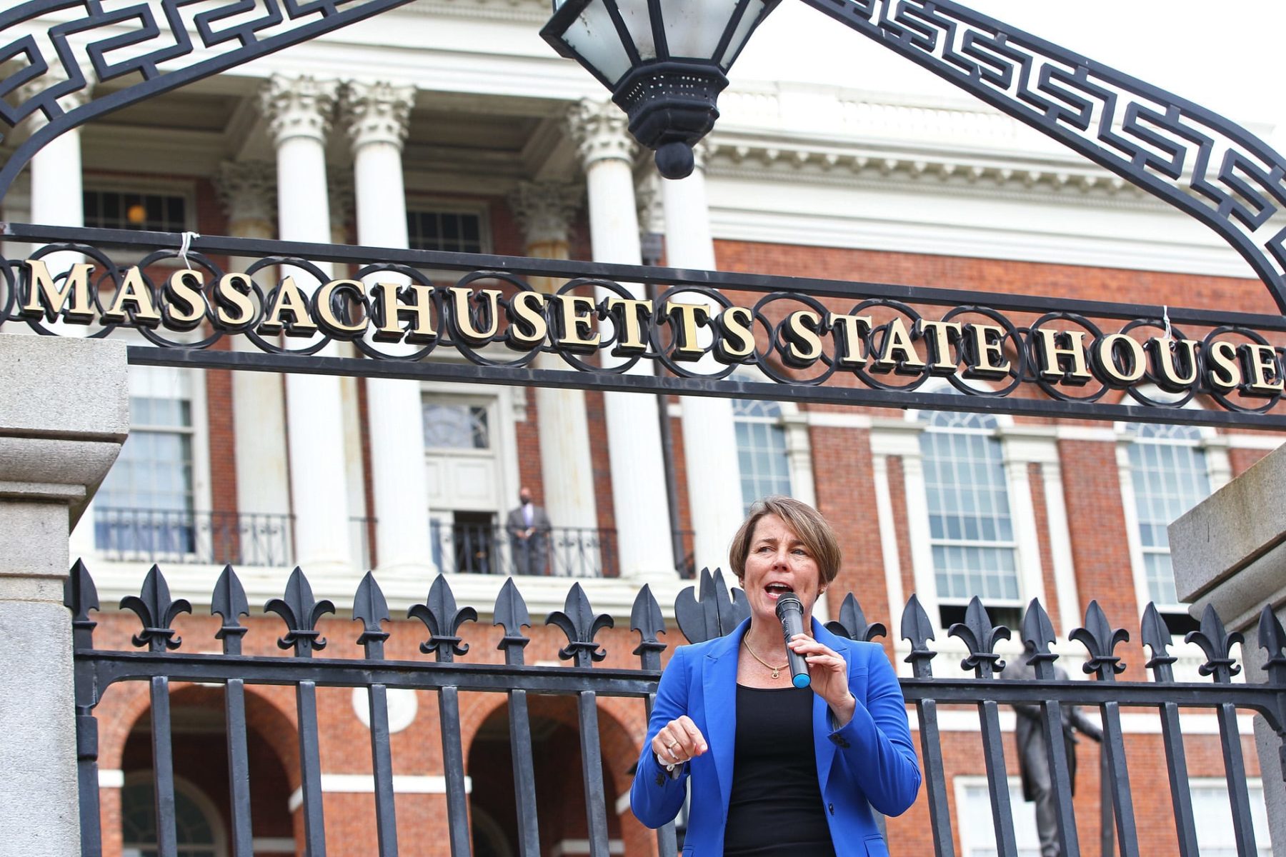 Attorney General Maura Healy standing in front of the Massachusetts State House.