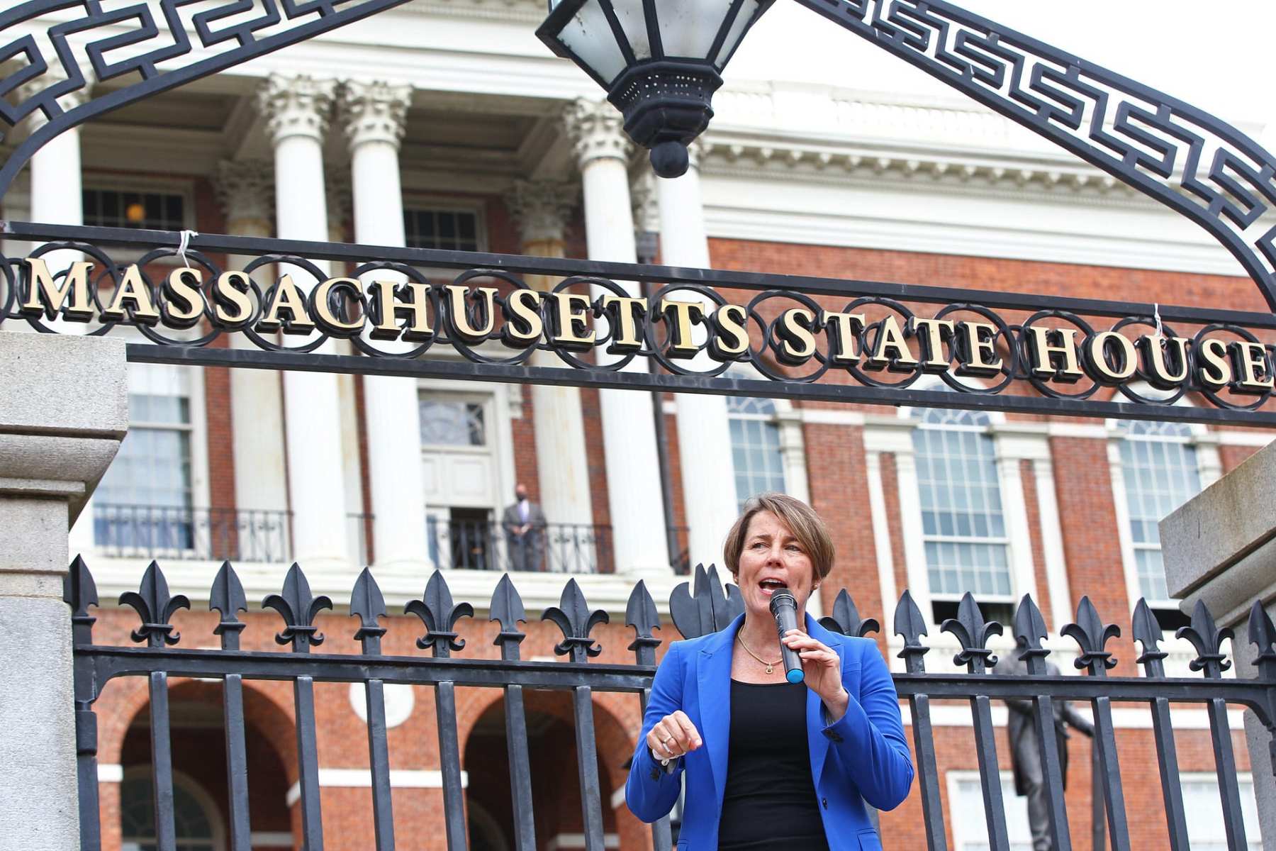 Attorney General Maura Healy standing in front of the Massachusetts State House.