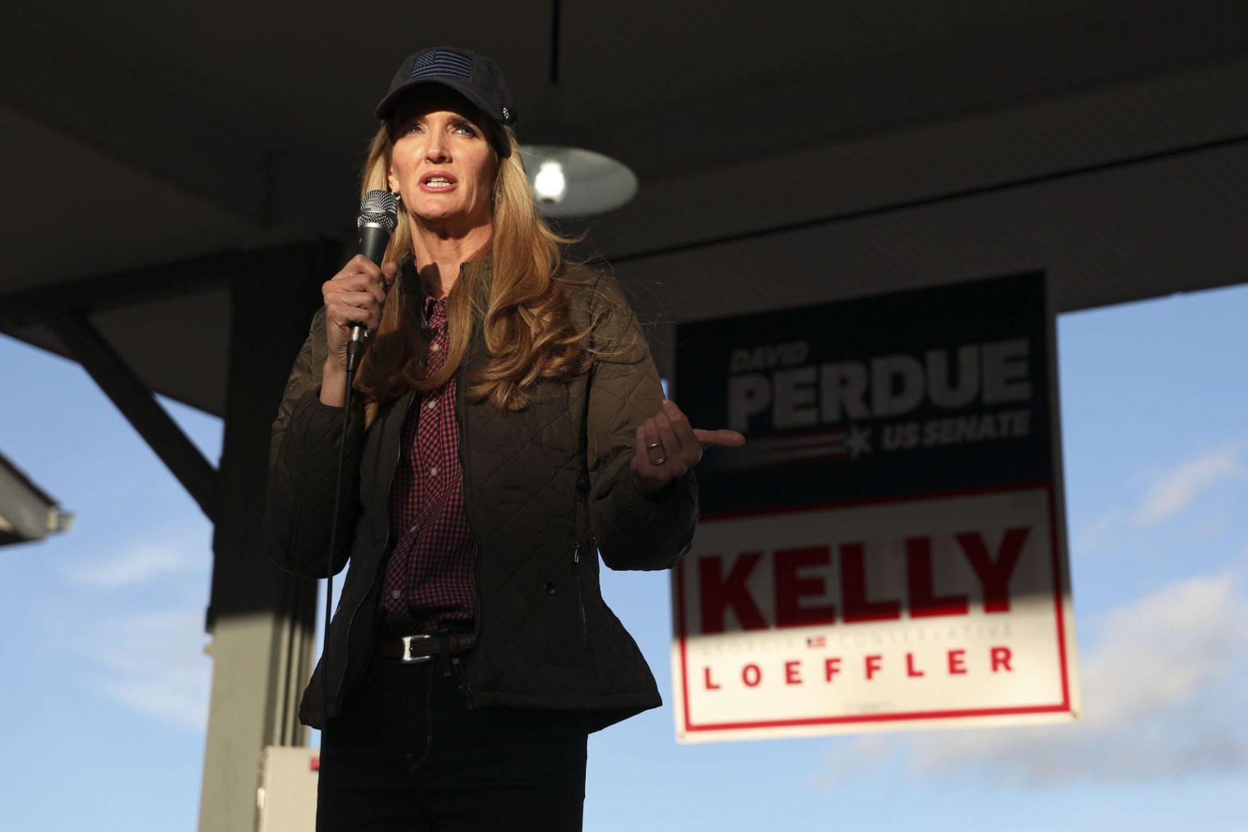 Senator Kelly Loeffler speaks to supporters during a rally.