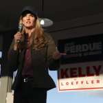 Senator Kelly Loeffler speaks to supporters during a rally.