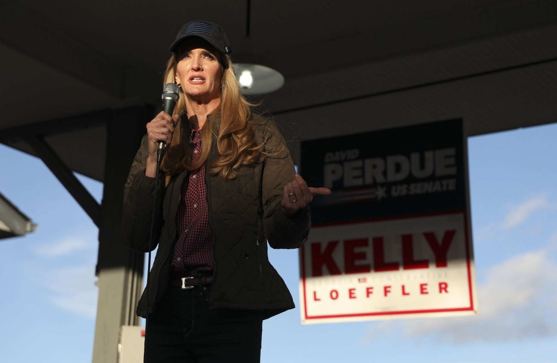 Senator Kelly Loeffler speaks to supporters during a rally.