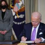 Joe Biden signs executive orders.