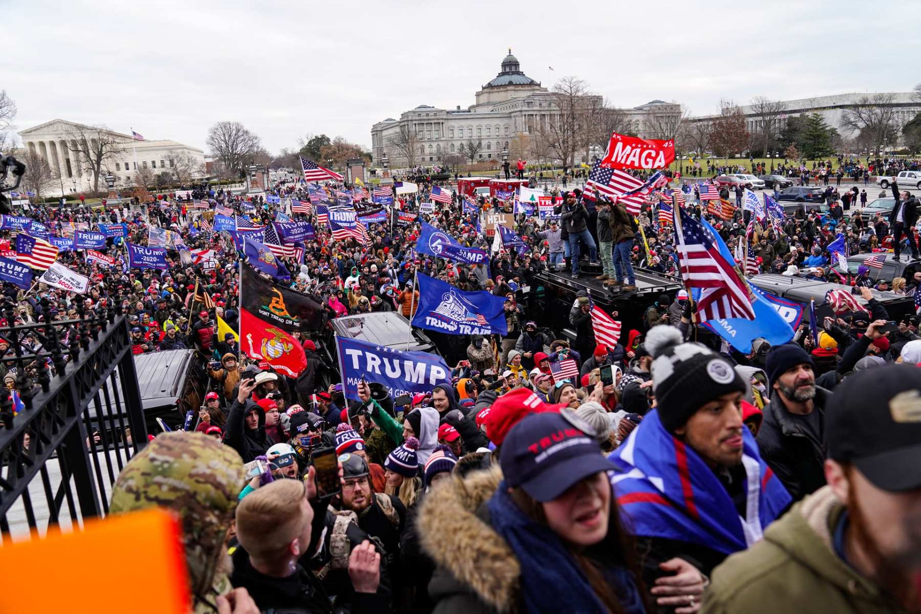 A crowd of pro-Trump supporters riot in front of the Capitol.