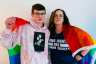 Jaime Gabrielli and her son Justin draped in an LGBTQ flag.
