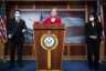 Sen. Elizabeth Warrens speaks from a podium at a news conference at the Capitol..