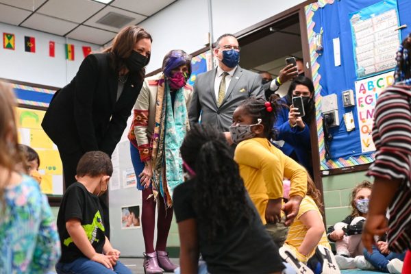 US Vice President Kamala Harris, Education Secretary Miguel Cardona (R), and US Representative Rosa DeLauro (C) visit a classroom at the West Haven Child Development Center in West Haven, Connecticut.