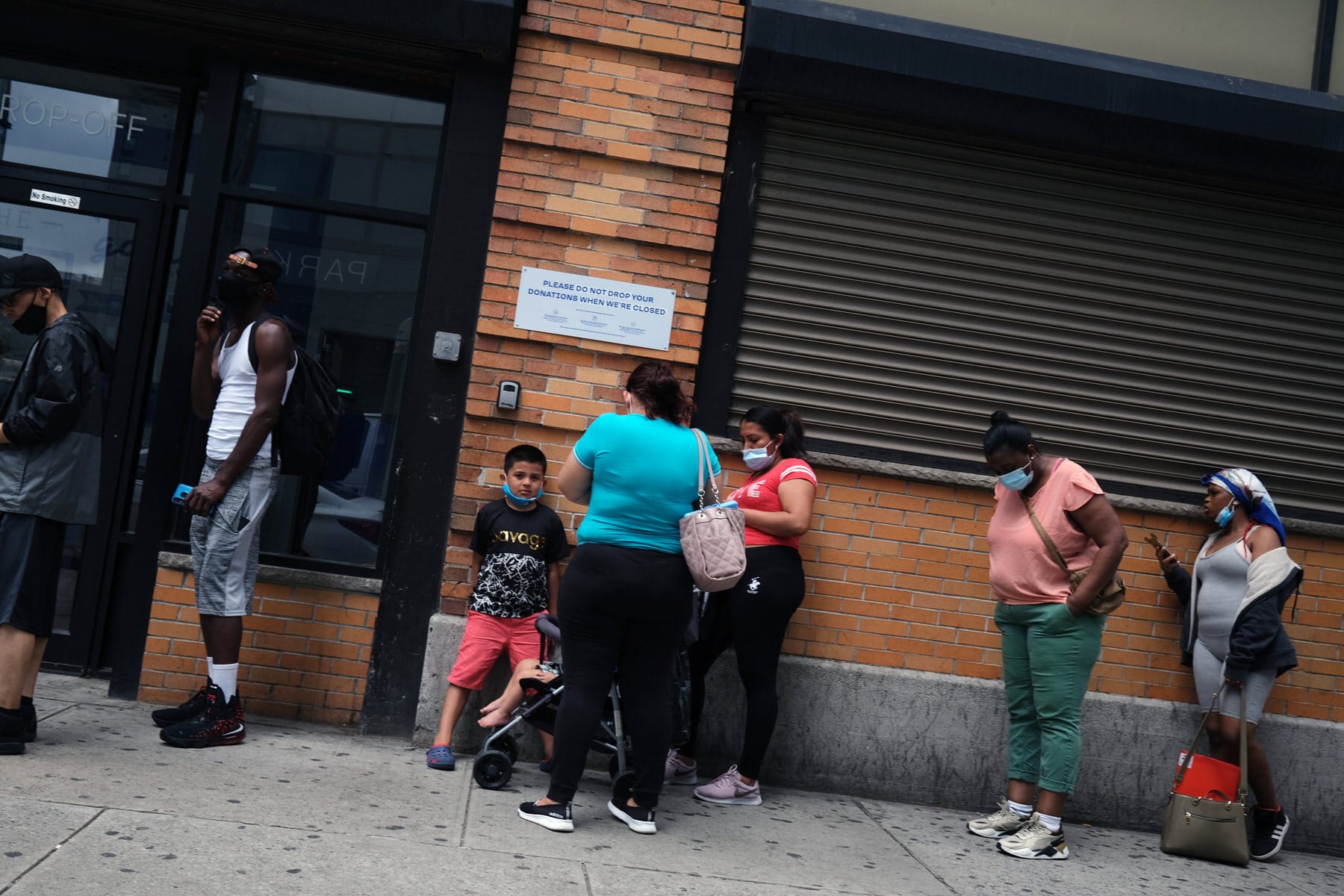 People wait in line for food assistance cards on July 07, 2020 in the Brooklyn borough of New York City.