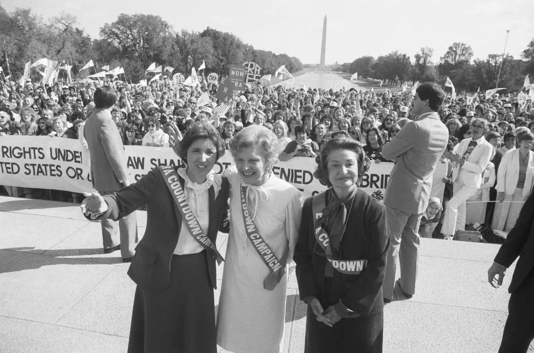 A historical photo of NOW President Eleanor Smeal, and former First Ladies, Betty Ford & Lady Bird Johnson urge ratification of the Equal Rights Amendment at a rally on the Lincoln Memorial Grounds.