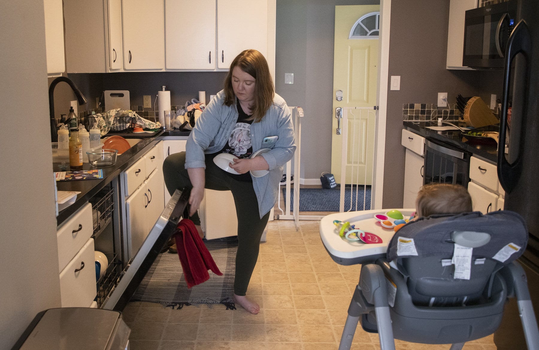 A mother prepares dinner for her child.