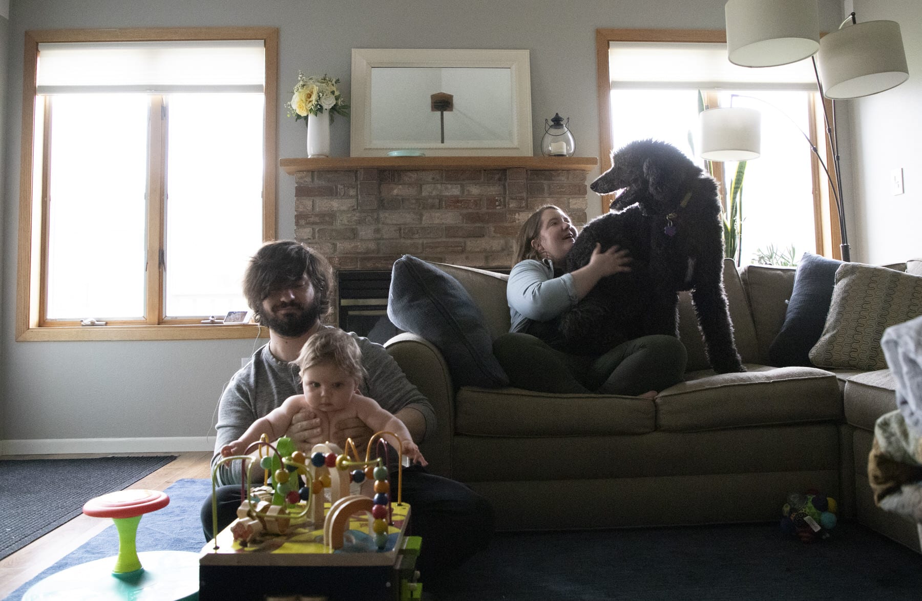 A family visits in their living room.