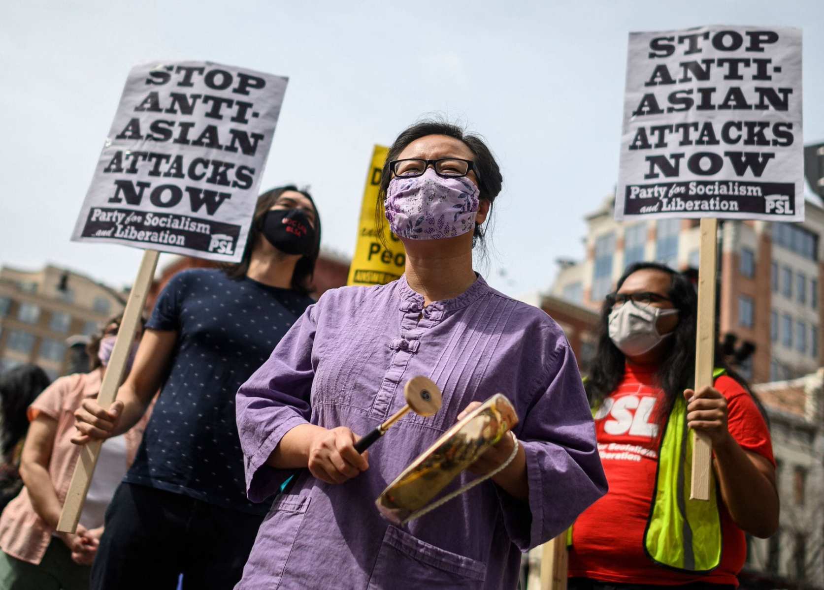 People participate in an 'Anti Asian Hate' rally in Chinatown in Washington, DC.