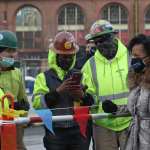 Kim Janey with construction workers in Boston
