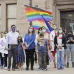 LGBTQ advocates demonstrate in front of the Texas State Capitol.
