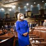 Rep. Liz Cheney (R-WY.) waits for the arrival of President Joe Biden before an address.