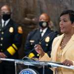 Atlanta Mayor Keisha Lance Bottoms speaks from a lectern at a news conference.