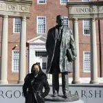 Maryland Del. Vanessa Atterbeary stands in front of a statue of Thurgood Marshall.