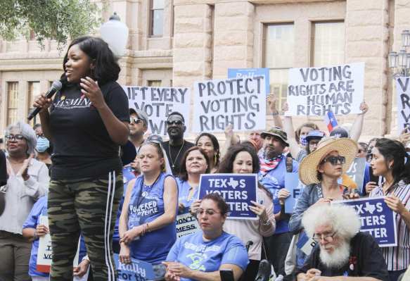 Representative Jasmine Crockett addresses the crowd at the For The People Rally in front of the Texas Capitol.
