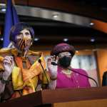 Rep. Rosa DeLauro speaks during a news conference at a podium.