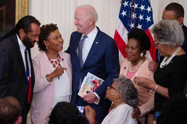 US President Joe Biden speaks with Opal Lee and guests in the White House.