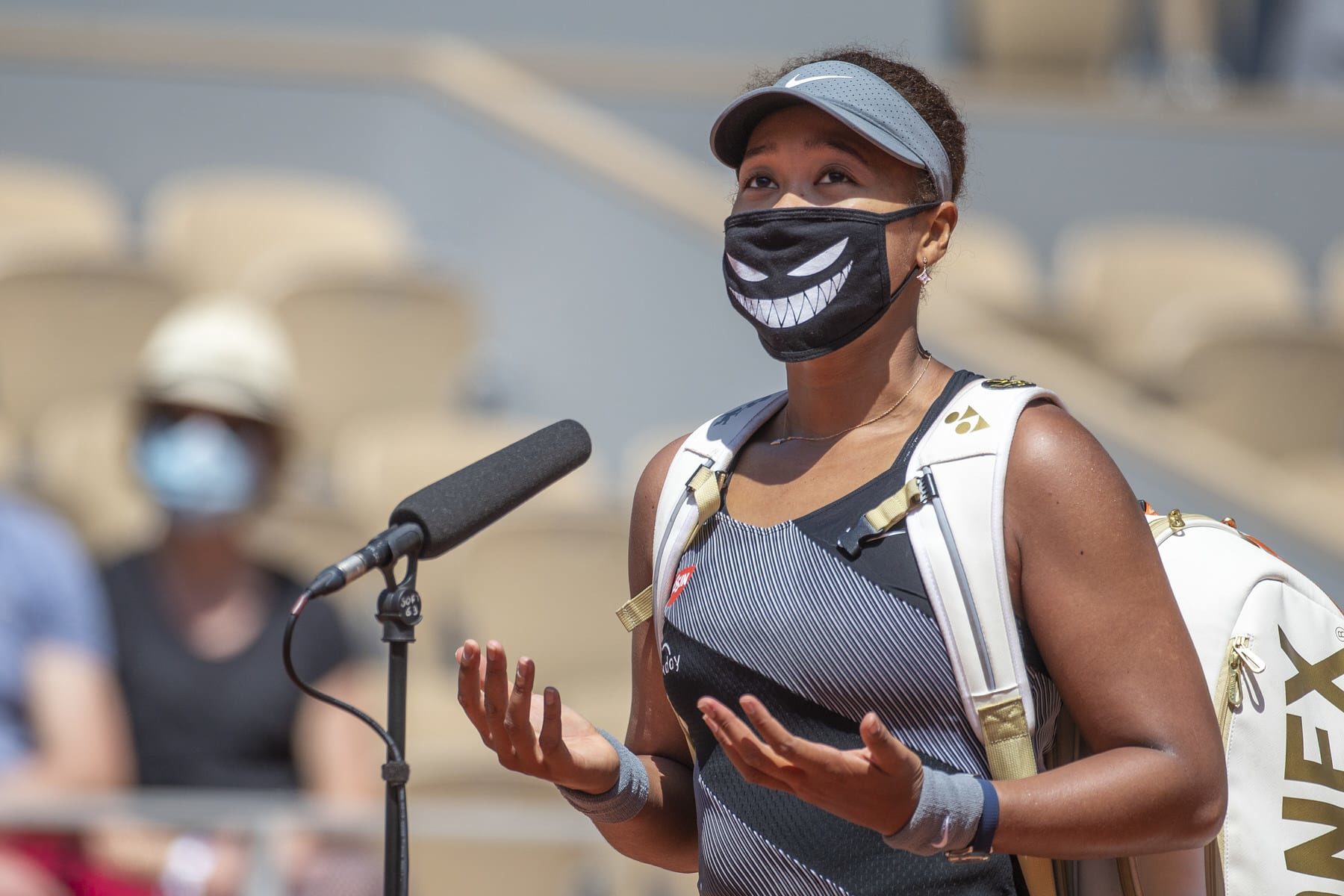May 30. Naomi Osaka of Japan conducts an on court interview wearing a mask after her victory against Patricia Maria Tig of Romania in the first round of the Women's Singles competition on Court Philippe-Chatrier at the 2021 French Open