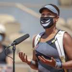 May 30. Naomi Osaka of Japan conducts an on court interview wearing a mask after her victory against Patricia Maria Tig of Romania in the first round of the Women's Singles competition on Court Philippe-Chatrier at the 2021 French Open