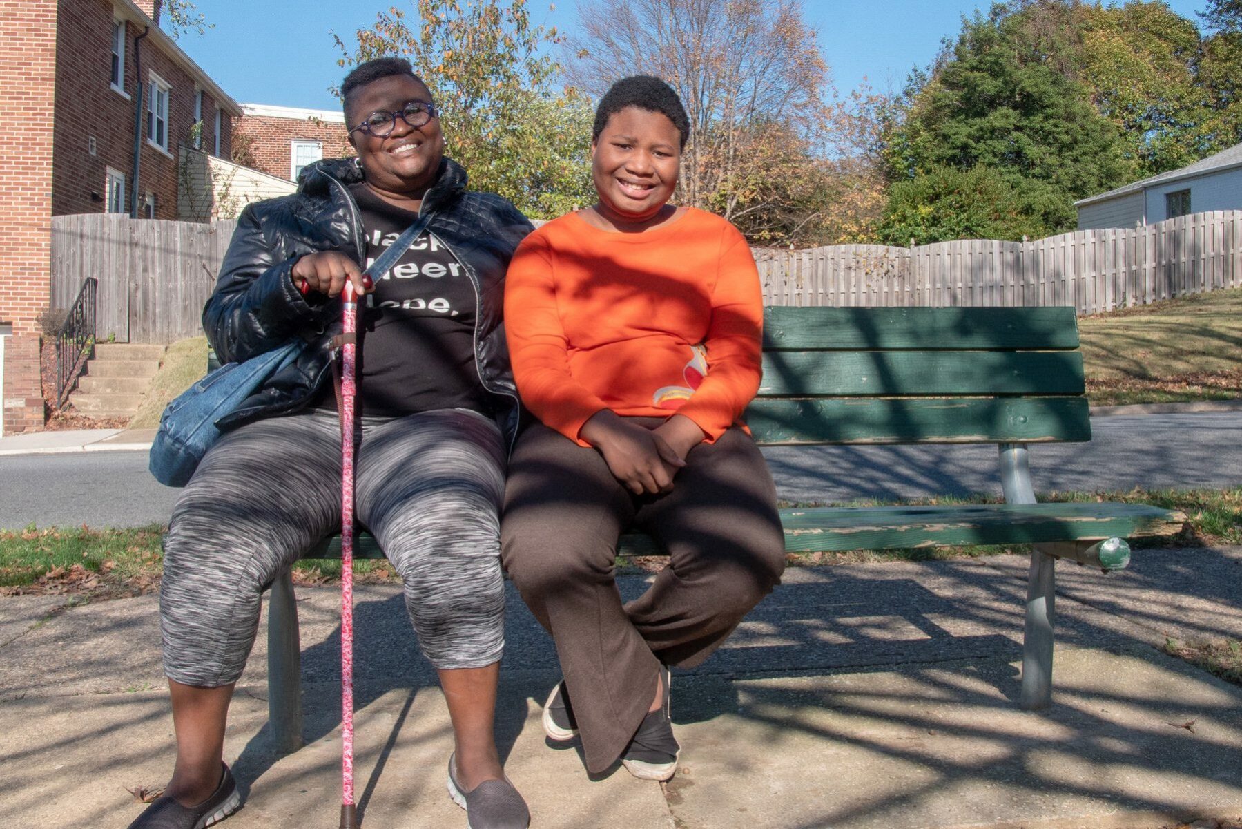 DeShanna Neal and her daughter Trinity Neal, on a park bench.
