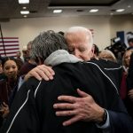 US President Joe Biden hugs an attendee during an event on January 21, 2020 in Ames, Iowa.