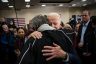 US President Joe Biden hugs an attendee during an event on January 21, 2020 in Ames, Iowa.