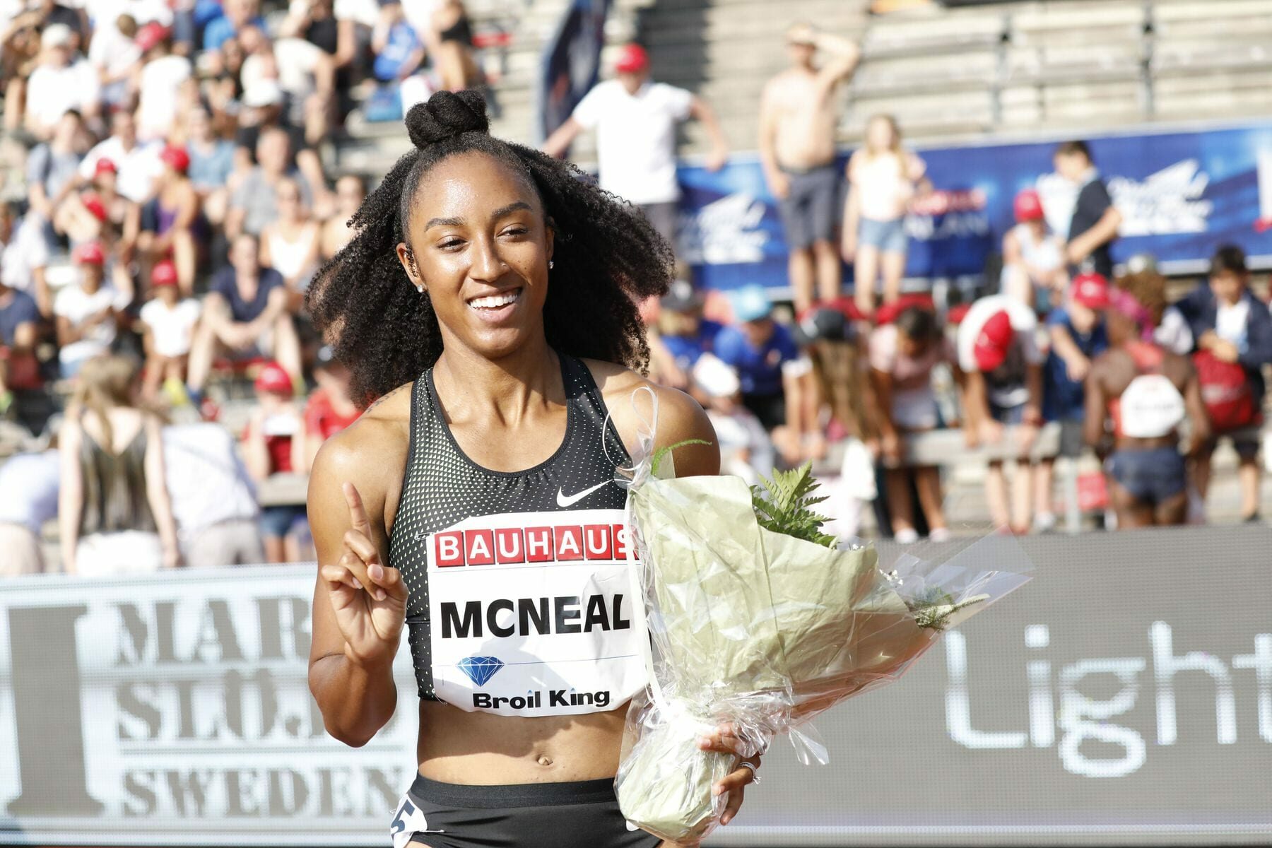 Brianna McNeal from USA, reacts after winning the women's 100m hurdles.