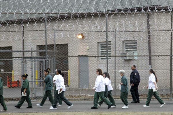Women walk on a road at the women-only Taconic Correctional Facility in Bedford Hills, N.Y., Wednesday, March 28, 2012. (AP Photo/Seth Wenig)
