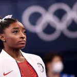 USA's Simone Biles looks on during the artistic gymnastics women's team final during the Tokyo 2020 Olympic Games at the Ariake Gymnastics Centre in Tokyo on July 27, 2021.