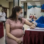 Pregnant woman gets vaccinated in Indonesia
